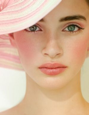 Think Pink - model with pale pink lips pink cheeks and pink sun hat.jpg